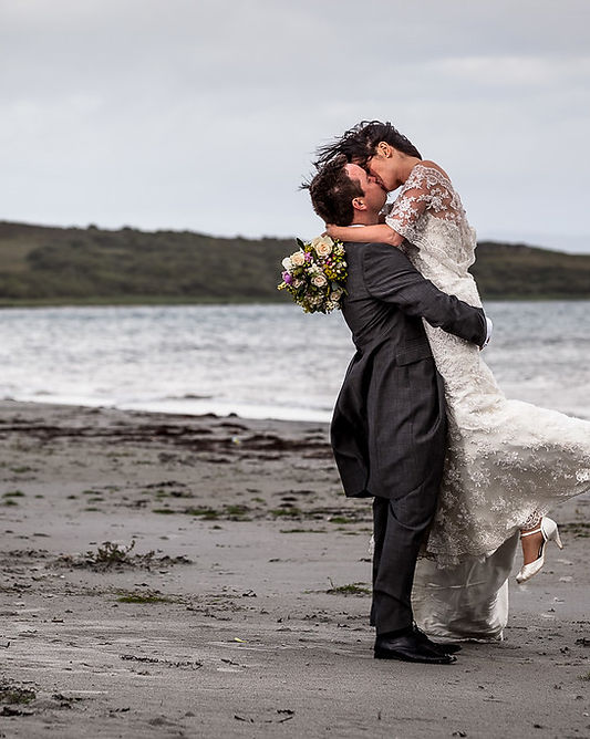 A bride and groom on a beach on Jura