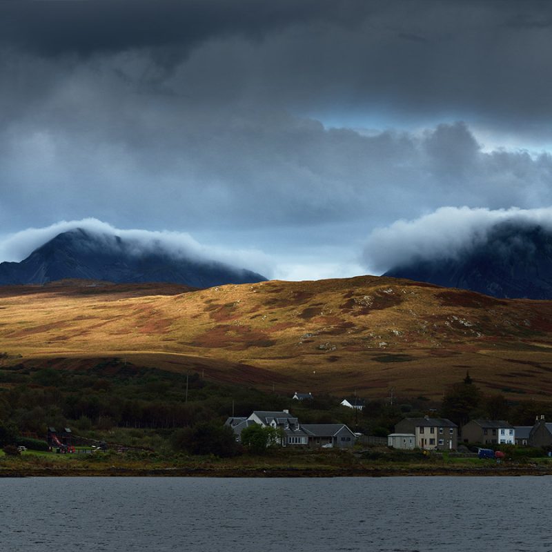 A stormy day and dramtic lighting with low clouds over The Paps of Jura in Scotland